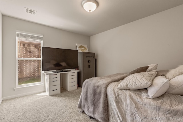 bedroom with visible vents and light carpet