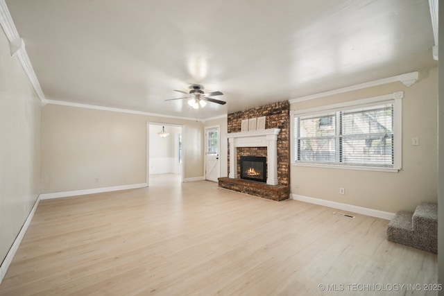 unfurnished living room featuring baseboards, light wood-type flooring, a ceiling fan, and crown molding