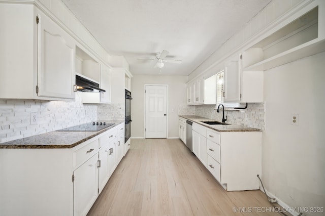 kitchen with open shelves, a sink, ceiling fan, under cabinet range hood, and black appliances
