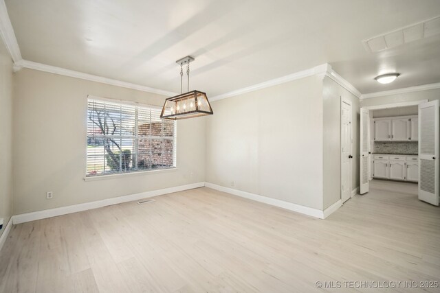 unfurnished dining area with ornamental molding, light wood finished floors, and visible vents