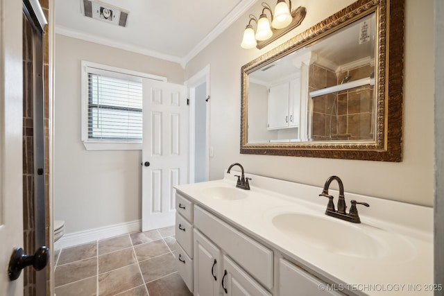 bathroom featuring ornamental molding, a tile shower, double vanity, and a sink