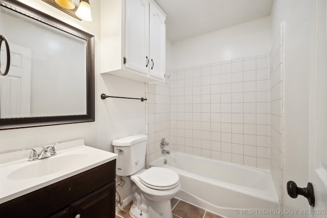 bathroom with toilet, tile patterned flooring, tub / shower combination, and vanity
