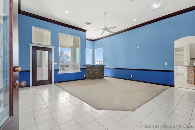 11746 Giorgio Dr, Skiatook, OK 74070 - interior space with crown molding, visible vents, ceiling fan, and baseboards
