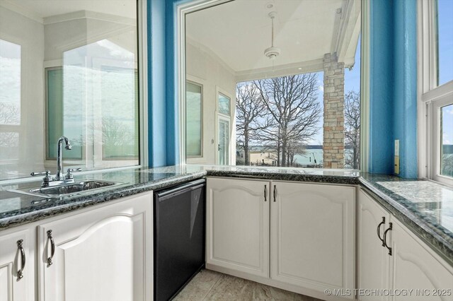 11746 Giorgio Dr, Skiatook, OK 74070 - kitchen with ornamental molding, dark stone countertops, white cabinetry, dishwasher, and a sink