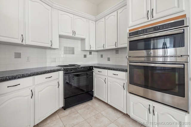 11746 Giorgio Dr, Skiatook, OK 74070 - kitchen with stainless steel double oven, black / electric stove, white cabinetry, and light tile patterned flooring