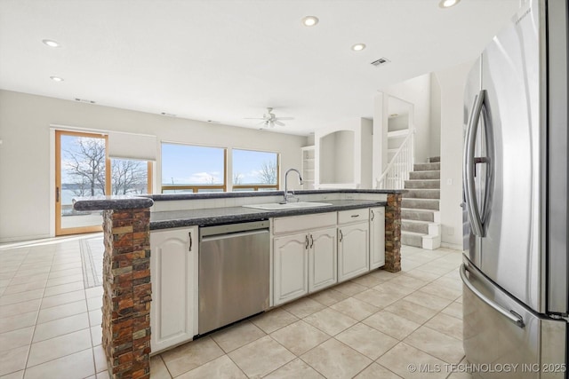 11746 Giorgio Dr, Skiatook, OK 74070 - kitchen with appliances with stainless steel finishes, light tile patterned floors, visible vents, ceiling fan, and a sink