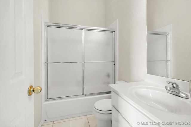11746 Giorgio Dr, Skiatook, OK 74070 - bathroom featuring toilet, combined bath / shower with glass door, vanity, and tile patterned flooring