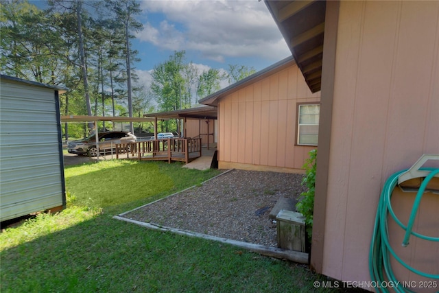 view of yard featuring a wooden deck