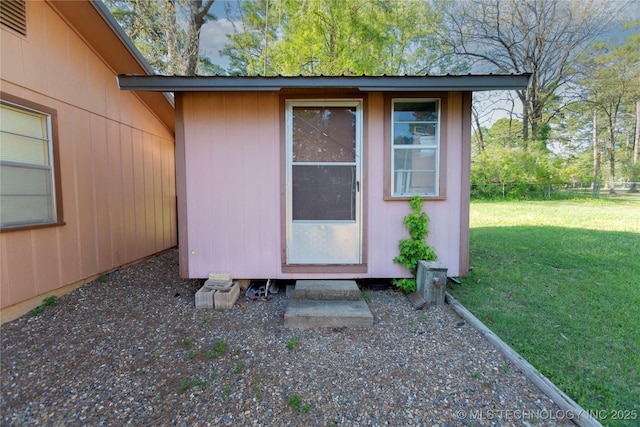 view of outbuilding featuring an outdoor structure and fence