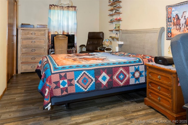 612 W Circle Dr, Broken Bow, OK 74728 - bedroom with dark wood-type flooring