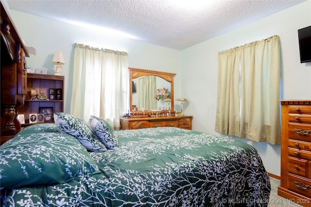 612 W Circle Dr, Broken Bow, OK 74728 - carpeted bedroom with a textured ceiling