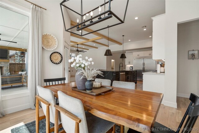 2996 E 142nd Ct S, Bixby, OK 74008 - dining area featuring baseboards, recessed lighting, light wood-style flooring, visible vents, and ceiling fan with notable chandelier