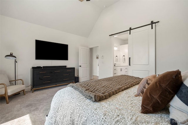 2996 E 142nd Ct S, Bixby, OK 74008 - bedroom with ensuite bathroom, light colored carpet, high vaulted ceiling, and a barn door