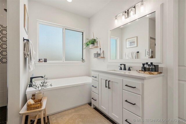 2996 E 142nd Ct S, Bixby, OK 74008 - full bath featuring a tile shower, a freestanding bath, and vanity
