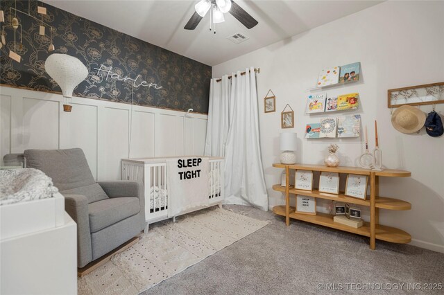 2996 E 142nd Ct S, Bixby, OK 74008 - bedroom with visible vents, a decorative wall, carpet floors, wainscoting, and wallpapered walls