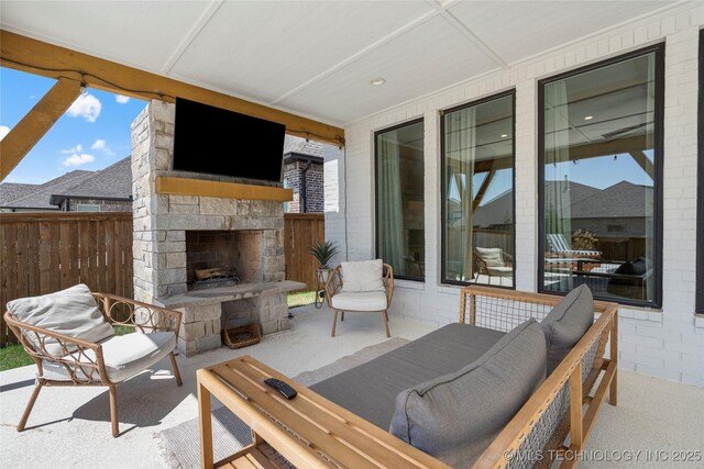 2996 E 142nd Ct S, Bixby, OK 74008 - view of patio / terrace with an outdoor living space with a fireplace and fence