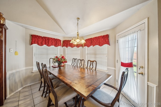 4932 W Commercial St, Broken Arrow, OK 74012 - dining room with light tile patterned flooring, a chandelier, vaulted ceiling, and baseboards