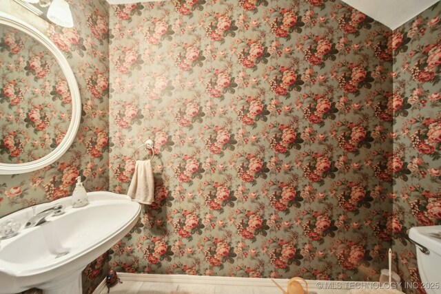 4932 W Commercial St, Broken Arrow, OK 74012 - bathroom featuring wallpapered walls, a sink, baseboards, and toilet