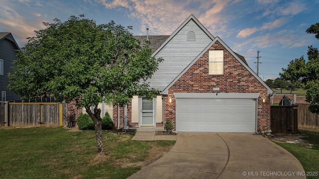 4932 W Commercial St, Broken Arrow, OK 74012 - view of front of house with driveway, brick siding, and a garage