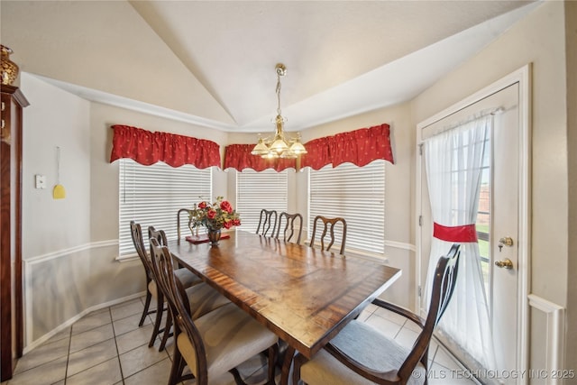 4932 W Commercial St, Broken Arrow, OK 74012 - dining space featuring light tile patterned floors, lofted ceiling, a chandelier, and baseboards