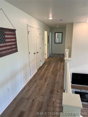 2241 231st St, Buffalo Valley, OK 74571 - corridor with baseboards and dark wood finished floors