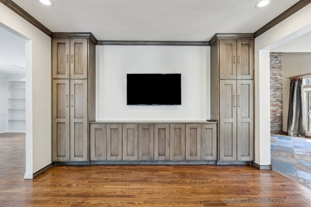 10126 S Granite Ave, Tulsa, OK 74137 - unfurnished living room featuring recessed lighting, ornamental molding, wood finished floors, and baseboards