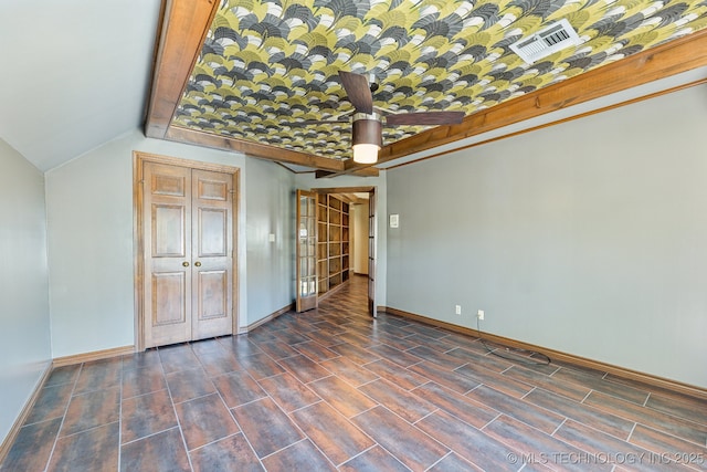 10126 S Granite Ave, Tulsa, OK 74137 - unfurnished bedroom featuring baseboards, wood tiled floors, and lofted ceiling