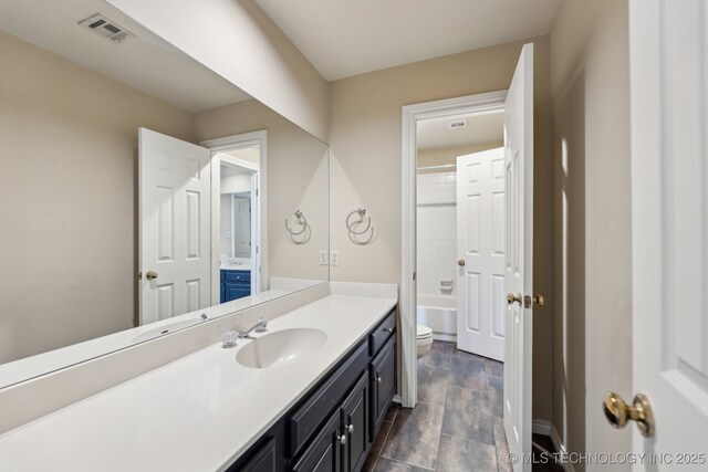 10126 S Granite Ave, Tulsa, OK 74137 - full bath with toilet, vanity, and tub / shower combination