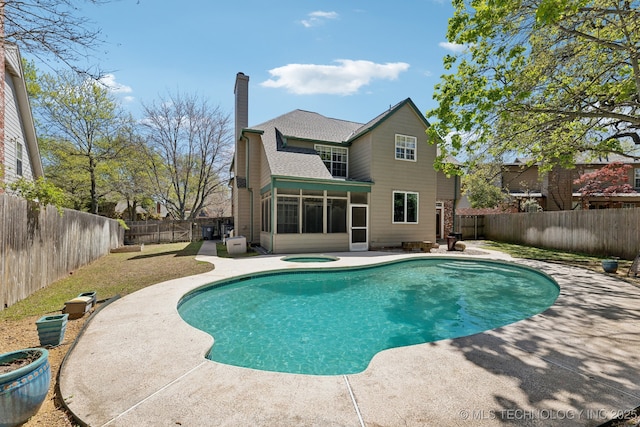10126 S Granite Ave, Tulsa, OK 74137 - rear view of house with a sunroom, a fenced backyard, a patio area, and a chimney