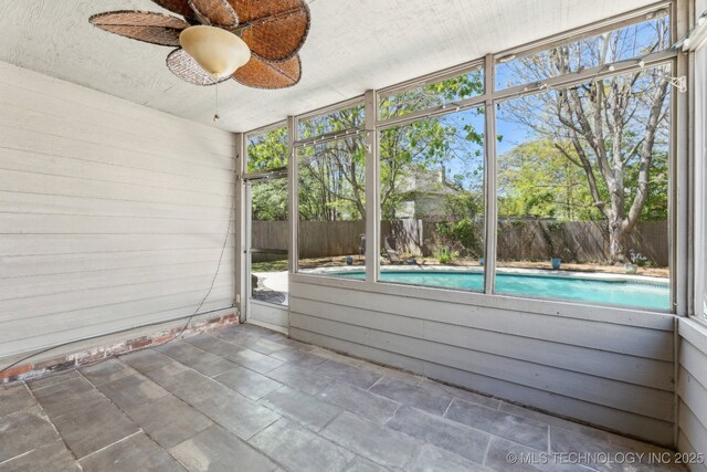 10126 S Granite Ave, Tulsa, OK 74137 - unfurnished sunroom featuring a ceiling fan and plenty of natural light