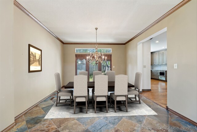 10126 S Granite Ave, Tulsa, OK 74137 - dining area with stone finish flooring, crown molding, a chandelier, and baseboards