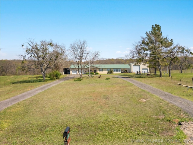 single story home with a front lawn and driveway