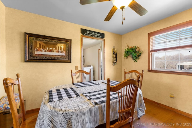 bedroom featuring baseboards, a ceiling fan, and wood finished floors
