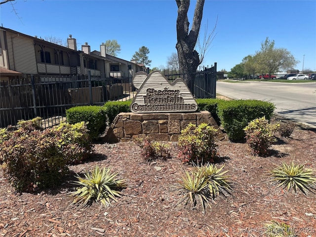 community sign featuring fence