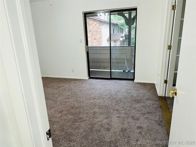 6524 S Memorial Dr Unit 16E, Tulsa, OK 74133 - spare room featuring dark colored carpet