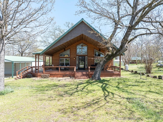back of house featuring a deck and a lawn