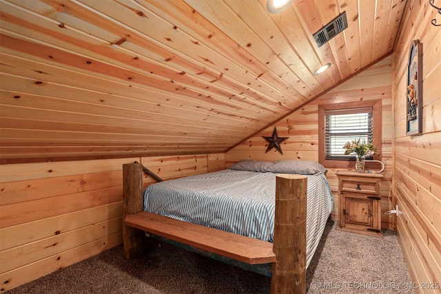 carpeted bedroom featuring wood ceiling, visible vents, wooden walls, and vaulted ceiling