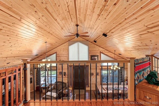 bonus room with wooden ceiling, ceiling fan with notable chandelier, vaulted ceiling, and wood finished floors