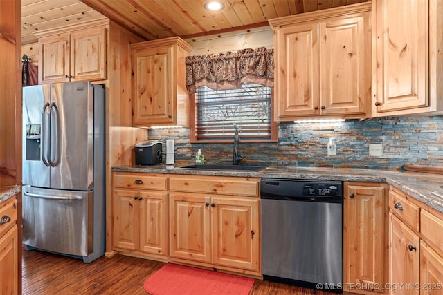 kitchen featuring appliances with stainless steel finishes, wood ceiling, a sink, light brown cabinetry, and wood finished floors