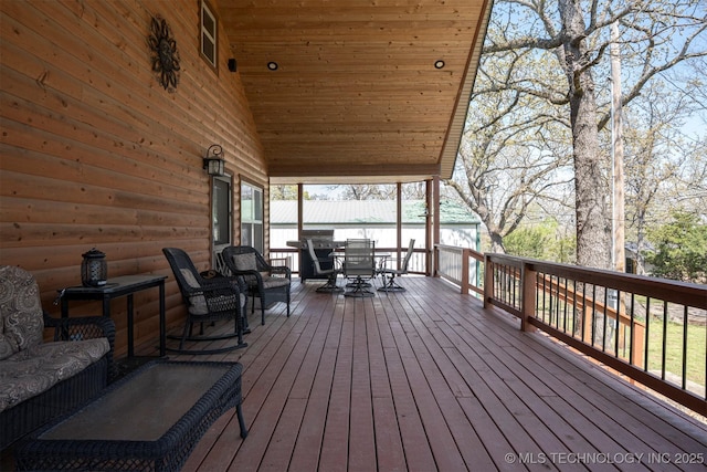 wooden deck with outdoor dining area