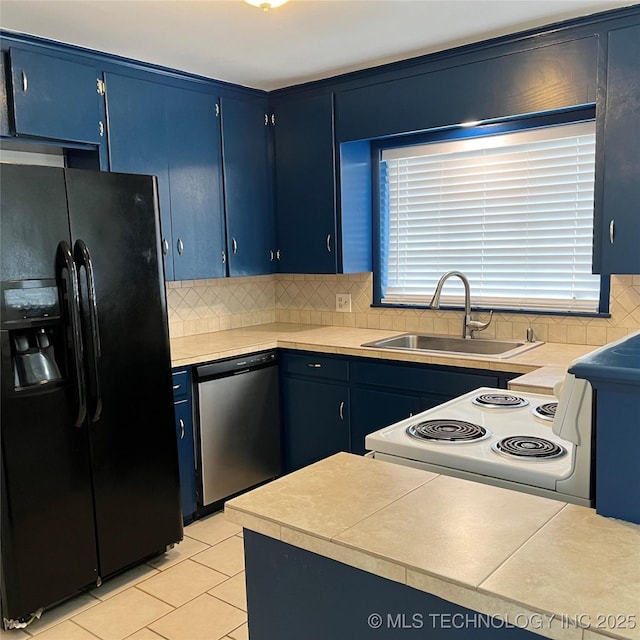 kitchen featuring black refrigerator with ice dispenser, dishwasher, a sink, electric stove, and blue cabinets