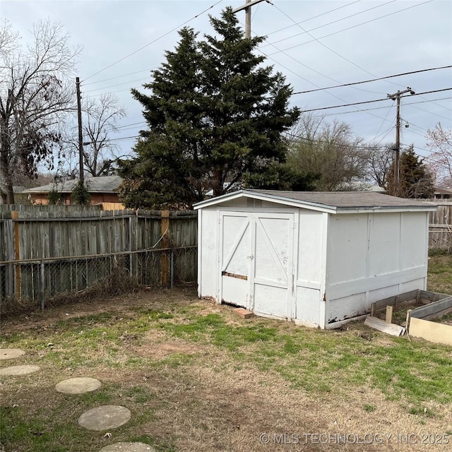 view of shed featuring fence private yard