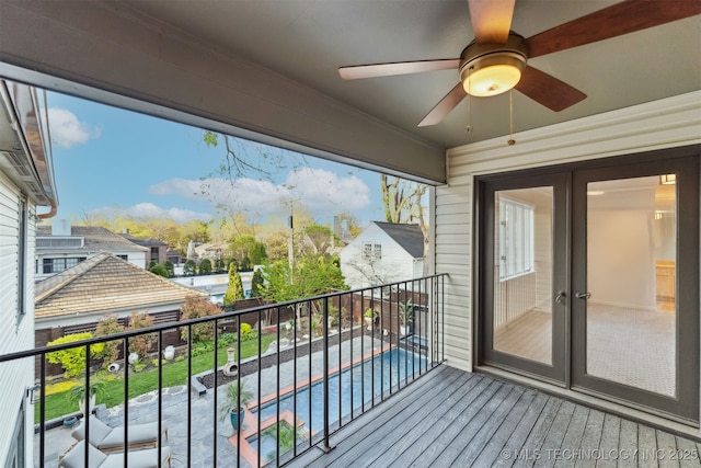 balcony with a ceiling fan and french doors