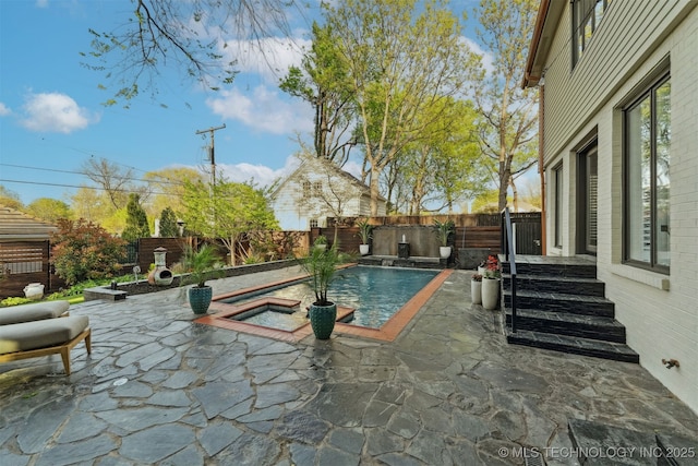 view of swimming pool with a patio, a fenced in pool, and a fenced backyard