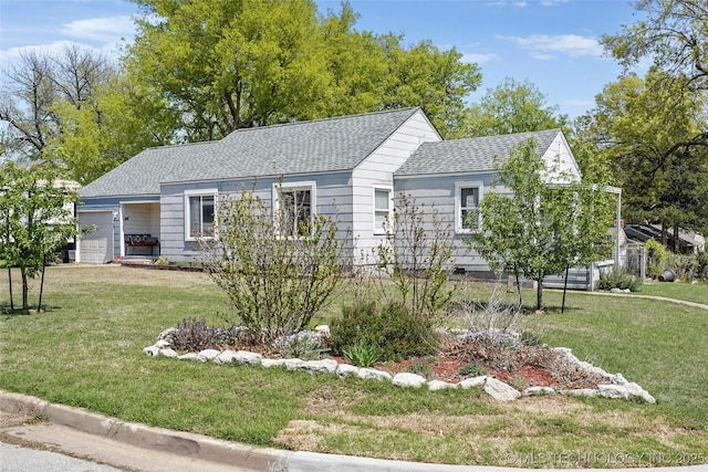 ranch-style house with an attached garage, a shingled roof, and a front yard