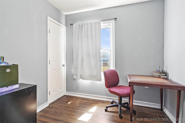 home office with baseboards and wood finished floors