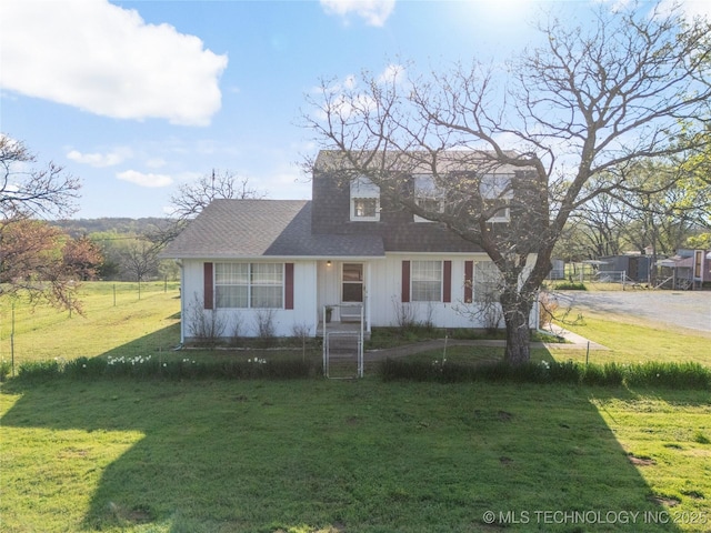 14531 S 107th W Ave, Sapulpa, OK 74066 - new england style home with a shingled roof and a front lawn