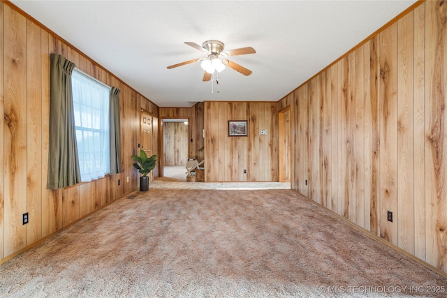 14531 S 107th W Ave, Sapulpa, OK 74066 - carpeted empty room featuring wood walls and a ceiling fan