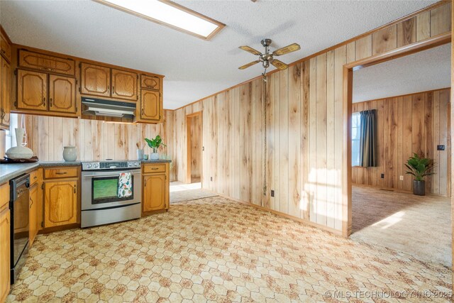 14531 S 107th W Ave, Sapulpa, OK 74066 - kitchen with electric range, a ceiling fan, under cabinet range hood, dishwasher, and wood walls