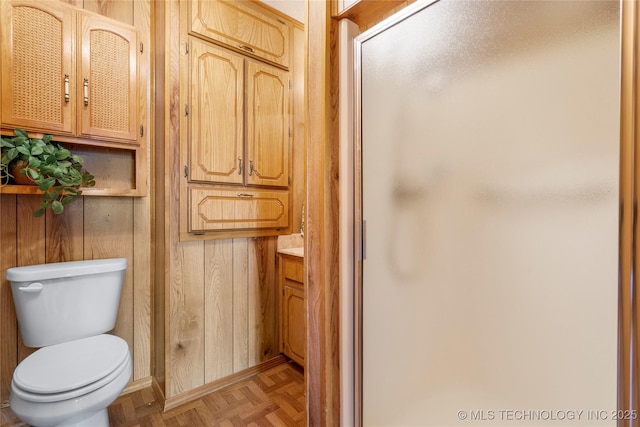 14531 S 107th W Ave, Sapulpa, OK 74066 - bathroom with toilet, wooden walls, vanity, and a stall shower
